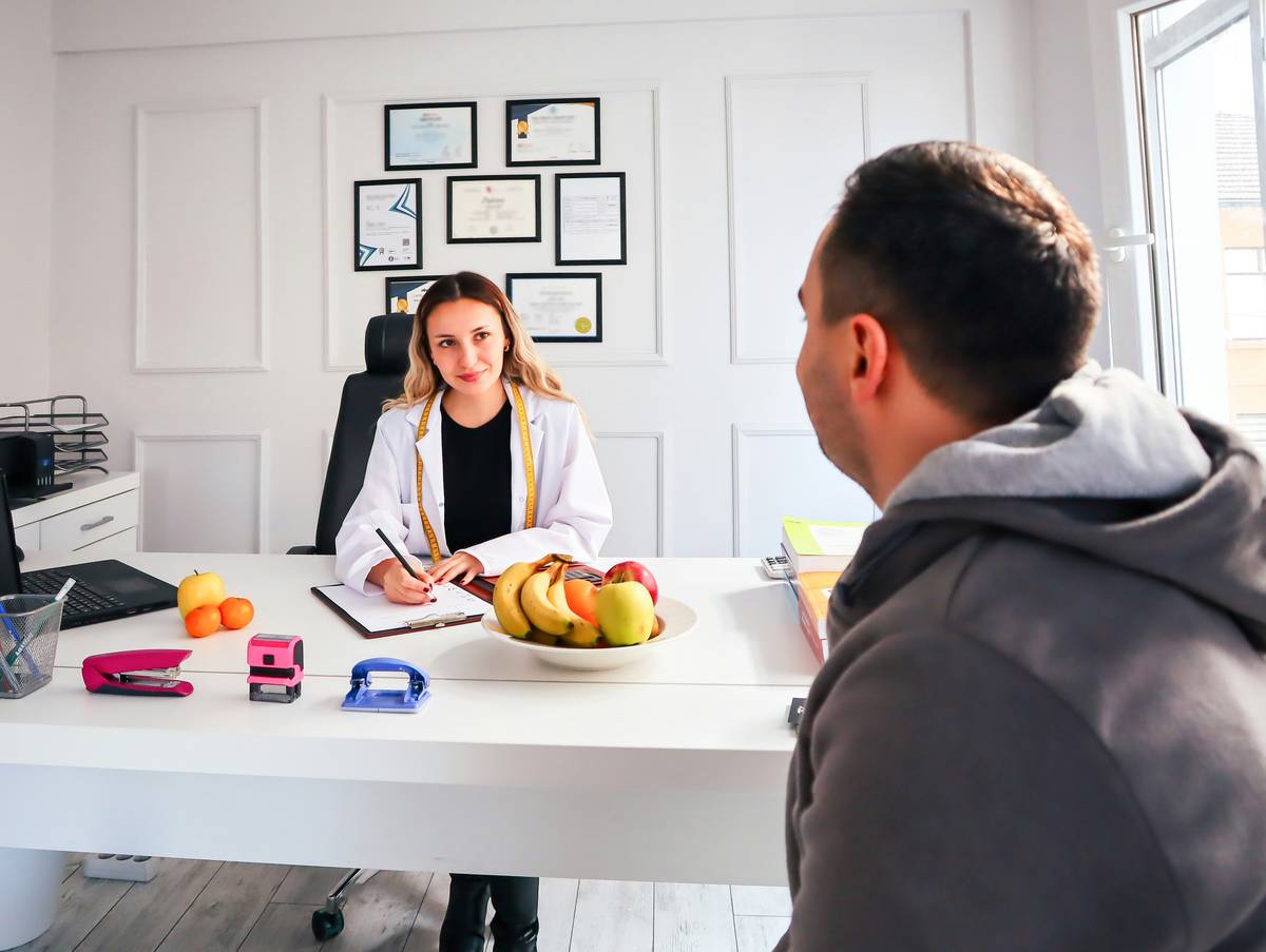 Female nutritionist private practice client session in home office